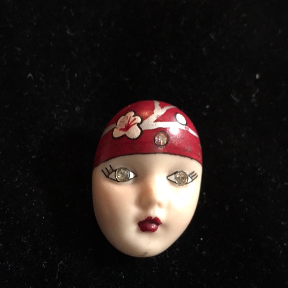 Signed Adagio Face Pin.